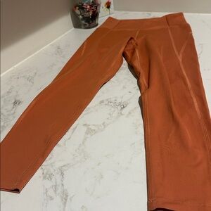 New Girlfriend Collective 7/8 Compressive High Rise Leggings dusty orange. Small